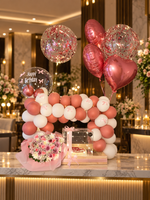 Load image into Gallery viewer, Rose pink balloon arch with heart foil balloons, pink bouquet and birthday cake in a clear box