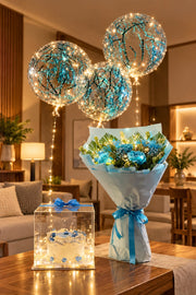 Azure Whisper gift arrangement with blue roses, glowing balloons and cake in luxury display box