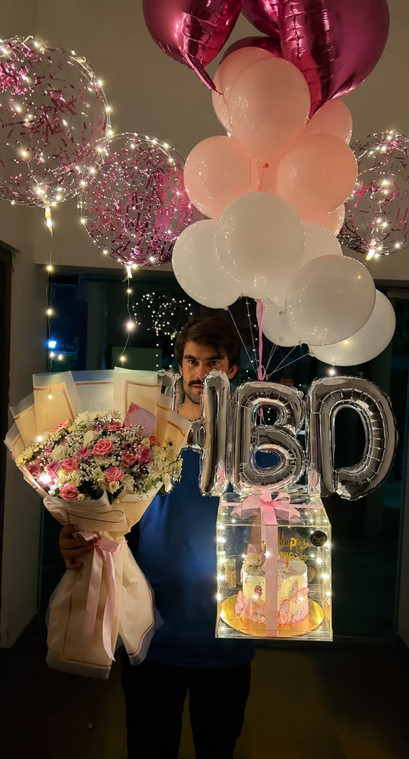 Premium floral birthday celebration box with fresh flower bouquet, LED acrylic cake box, HBD balloons, and pink heart balloons