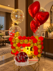 Ruby Royale Gift Set with red roses, birthday cake, heart balloons and red-gold balloon arch
