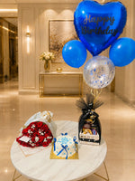 Load image into Gallery viewer, Blue birthday balloon setup with red rose bouquet, cake and chocolate gift basket