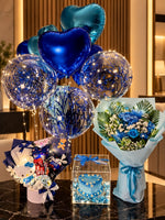 Load image into Gallery viewer, Sapphire Serenade gift arrangement with blue flowers, balloons, cake box and luxury gift hamper