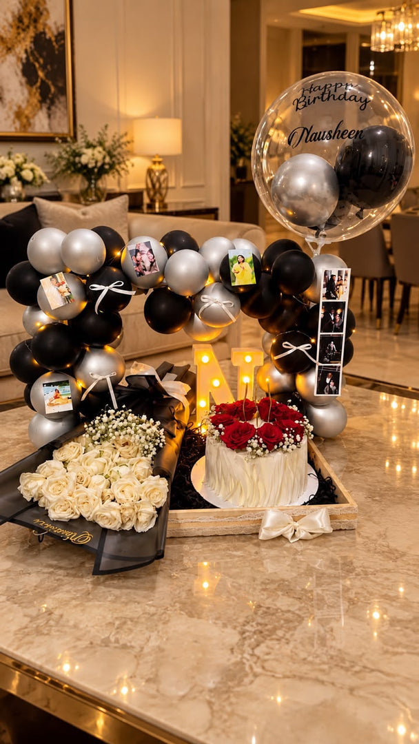 Noir Memory Elegance black and silver balloon arch with photo display, roses and birthday cake