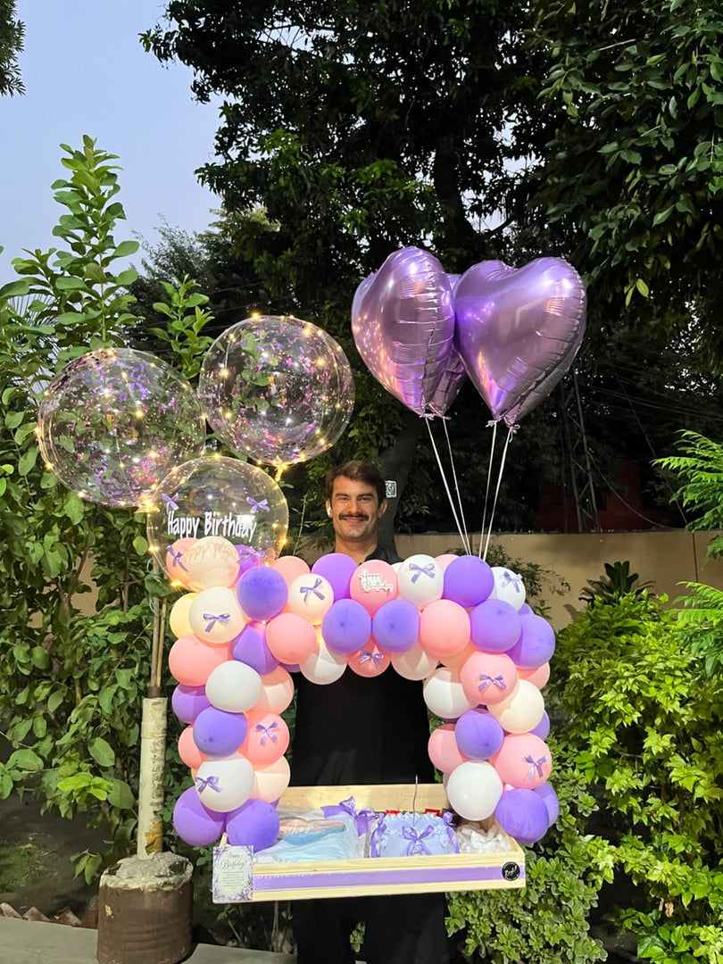 Lavender and pink balloon birthday gift arrangement