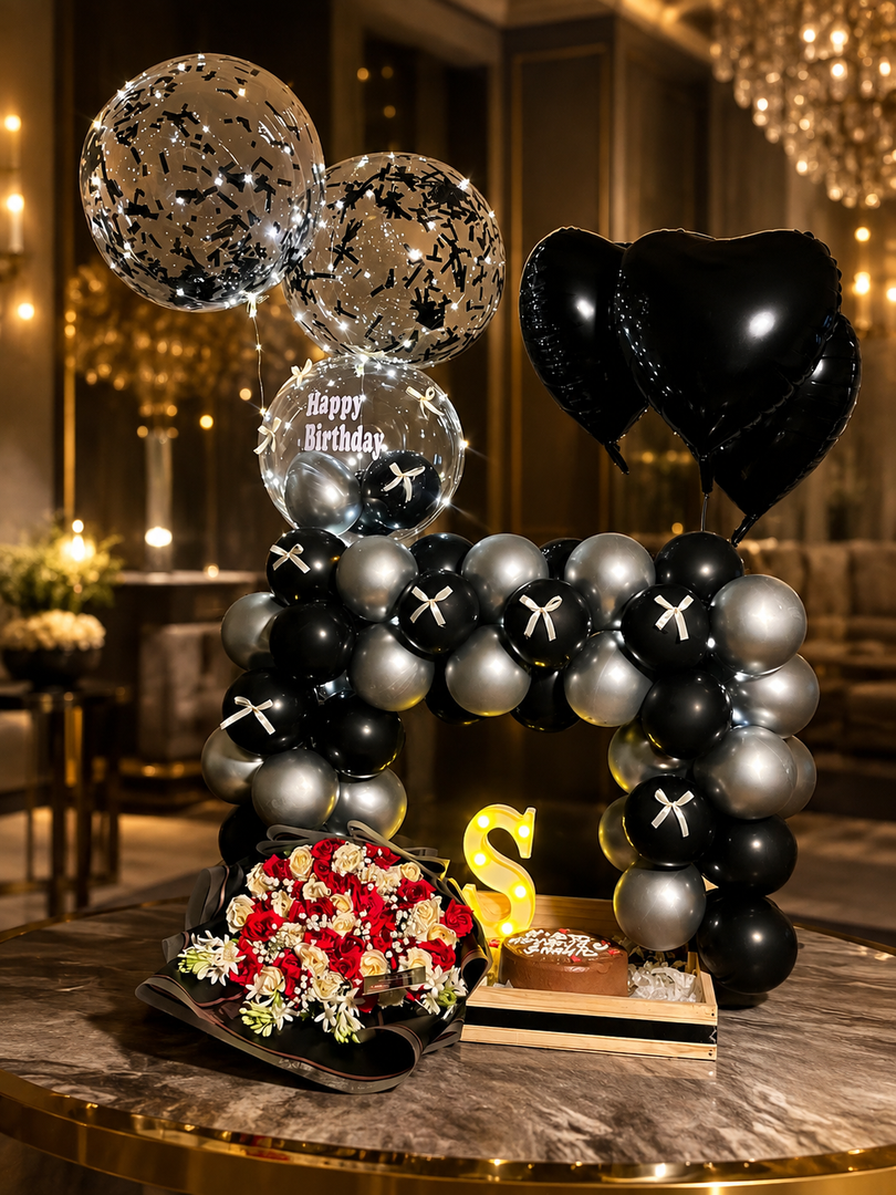 Elegant Eclipse Birthday Suite featuring metallic balloons, floral arrangement, and premium birthday celebration decor