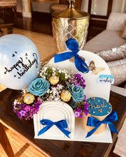  White arch birthday gift set with blue roses, Ferrero Rocher, mini name cake and Happy Birthday balloon