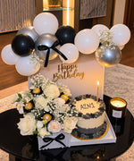 Load image into Gallery viewer,  Black, white and silver birthday set with cream roses, custom name cake, Ferrero Rocher and balloon garland