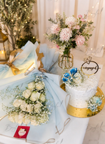 Load image into Gallery viewer, Azure Promise Ensemble with white rose bouquet, engagement cake, blue floral accents, and personalized engaged topper.