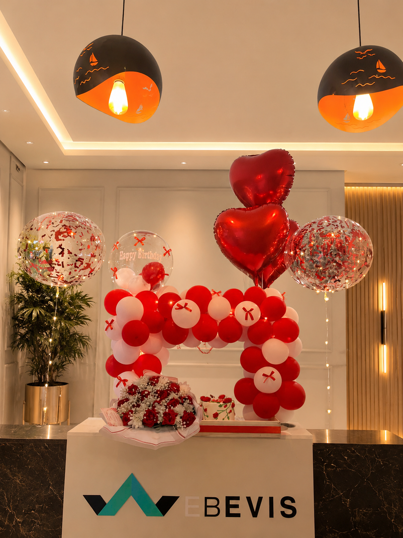 Red Velvet Arch with red and white balloons, heart-shaped balloons and confetti-filled balloons