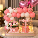 Load image into Gallery viewer, Rosavelle Bloom pink birthday gift arrangement with a decorated cake, pink and white flower bouquet, heart-shaped balloons, and balloon arch.