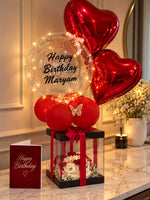 Load image into Gallery viewer, Love In Red luxury gift arrangement with red heart balloons, cake, bubble balloon and romantic décor
