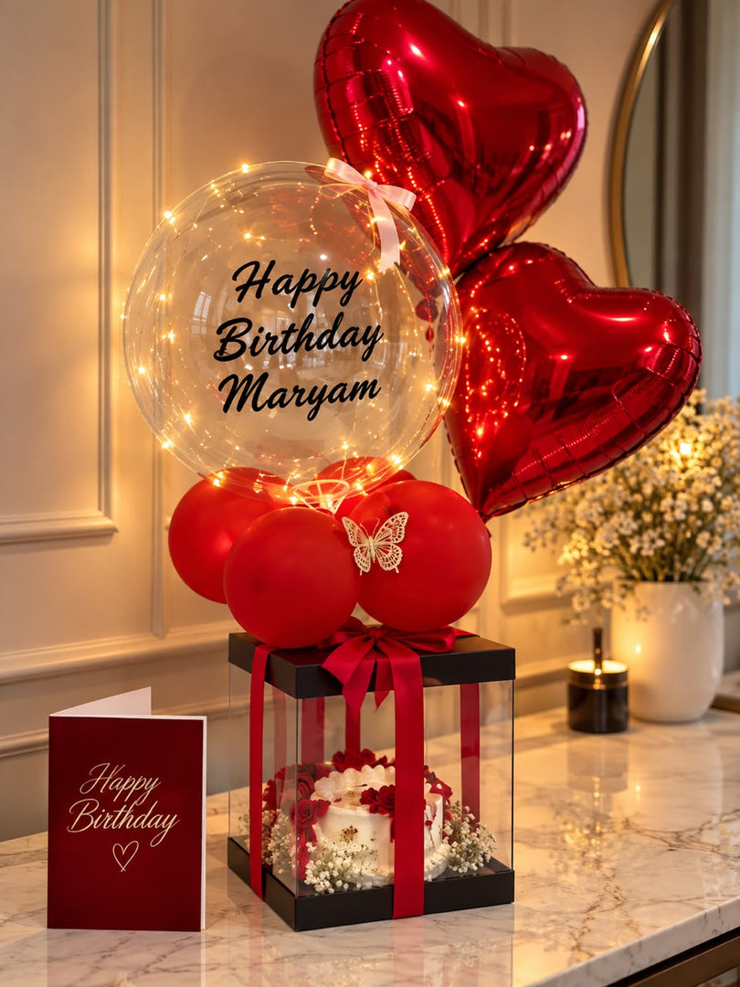 Love In Red luxury gift arrangement with red heart balloons, cake, bubble balloon and romantic décor