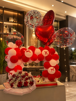 Load image into Gallery viewer, Red Velvet Arch with red and white balloons, heart-shaped balloons and confetti-filled balloons