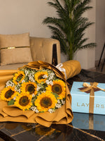 Load image into Gallery viewer, Yellow sunflower bouquet wrapped in golden paper paired with a Milky Malt Cake gift.