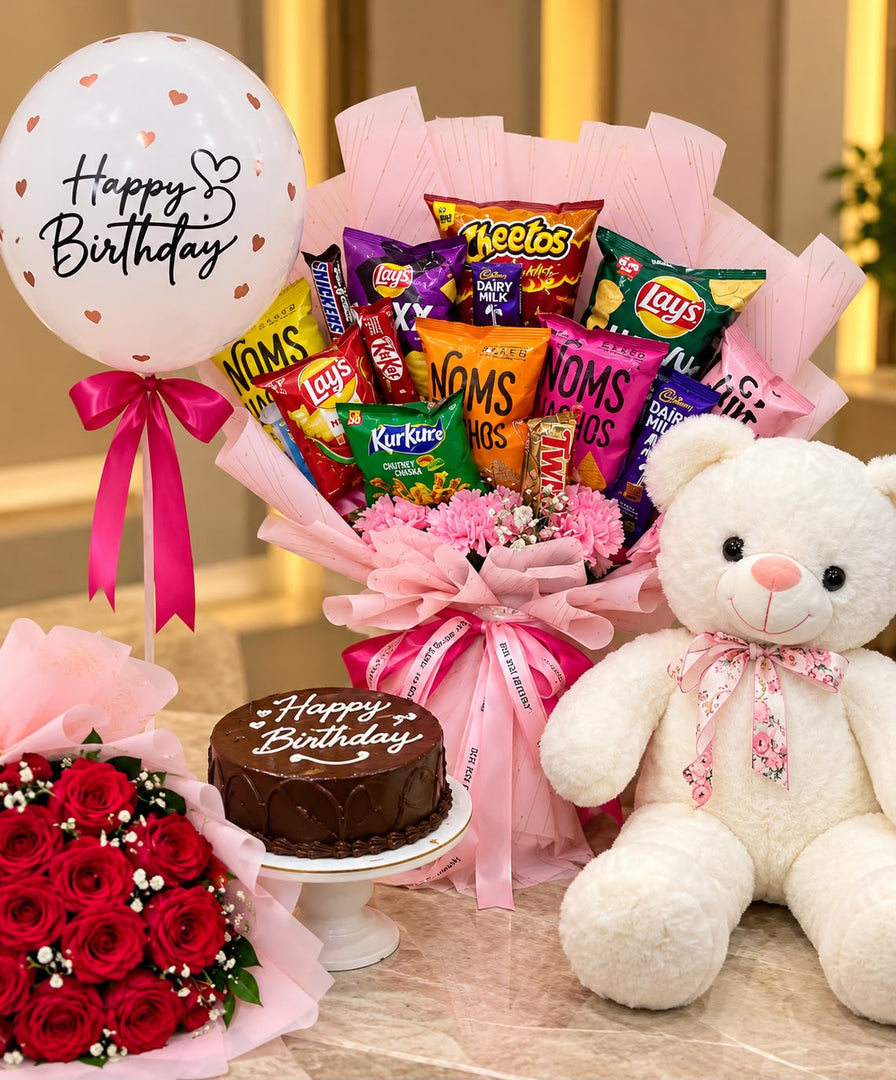 Birthday Bliss Hamper with snacks, chocolates, white teddy bear, birthday cake, red roses and Happy Birthday balloon.