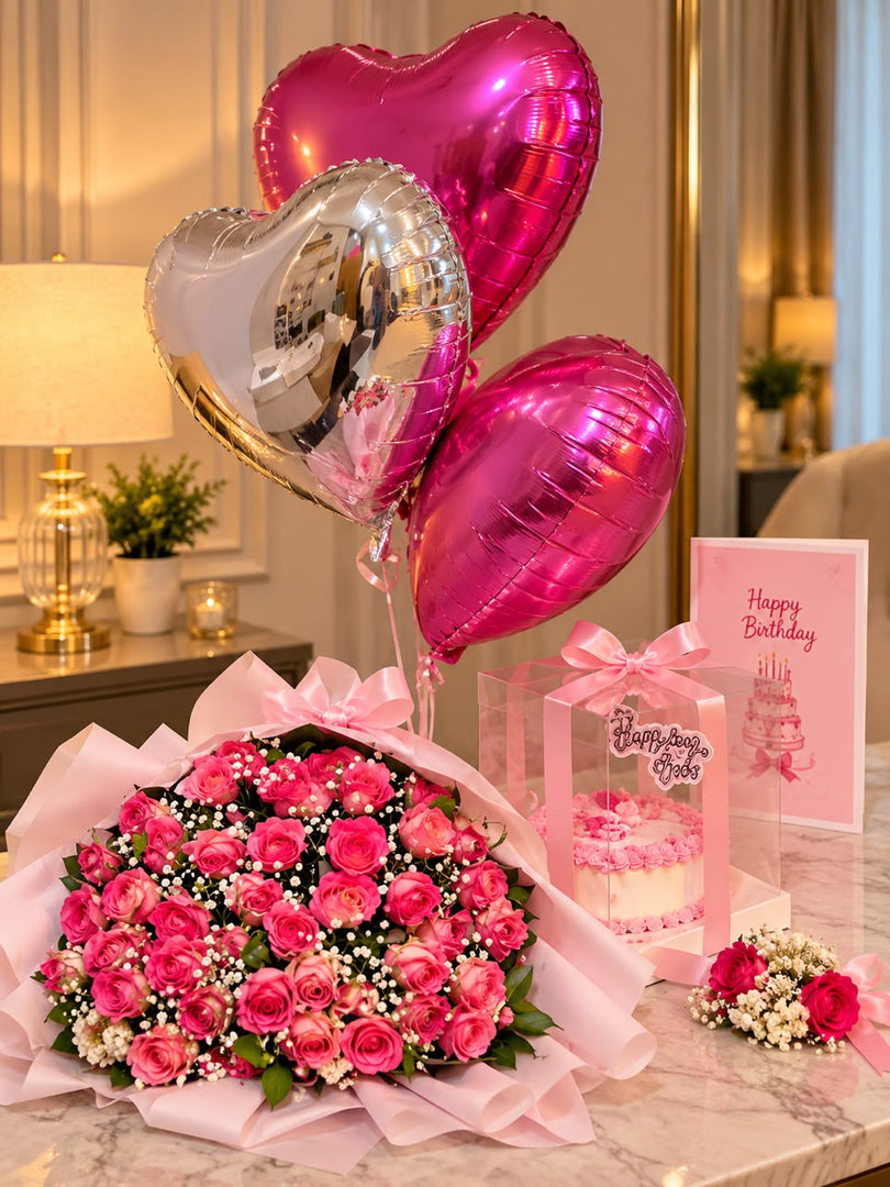 Rose Gold Romance gift arrangement with pink roses, heart balloons, cake box and luxury romantic decoration
