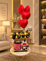 Load image into Gallery viewer, Black and gold birthday setup with red heart balloons and roses