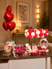 Crimson Cherish romantic gift arrangement with red roses, teddy bear, cake, chocolates and red and white balloons