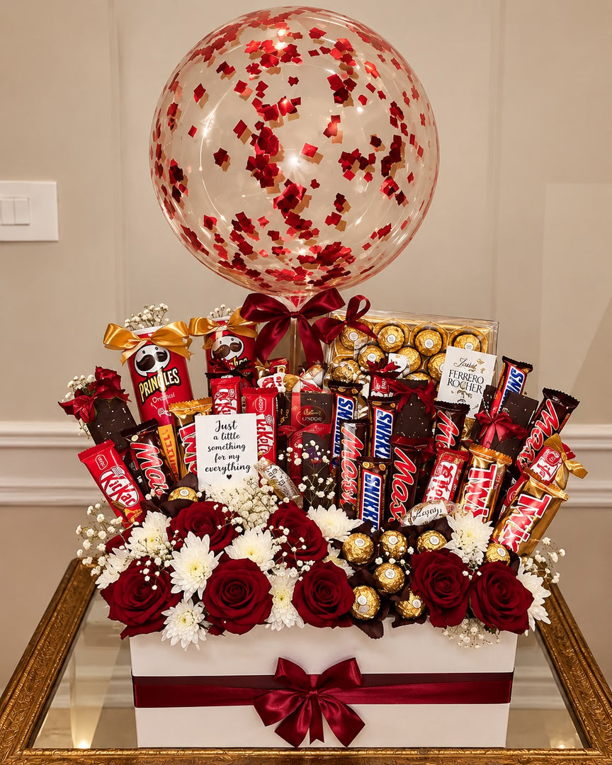 Gift box of red roses, Ferrero Rocher, Snickers, KitKat and Pringles topped with a red confetti balloon