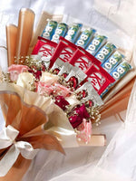 Load image into Gallery viewer, KitKat and Bounty Chocolate Bouquet with Soft Peach Wrap | BCG-013
