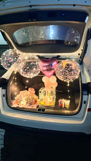 Luxe Celebration Box with fresh flower bouquet, LED acrylic cake box, decorative balloons, and elegant gift presentation