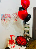 Load image into Gallery viewer, Luxury gift arrangement with red rose bouquet, cake gift box, heart balloons, and balloon decoration