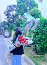 Flora Velvet premium red rose bouquet with silver wrapping and metallic balloons