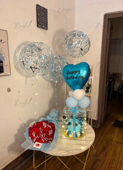 Premium Celestial Bloom gift box featuring fresh flowers, birthday cake, transparent display box, and balloons