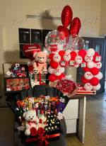 Load image into Gallery viewer, Luxury anniversary gift box with roses, chocolates, teddy bears, personalized gifts, and elegant anniversary balloon setup in Pakistan