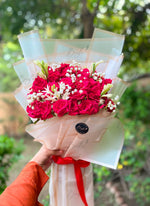 Load image into Gallery viewer, Rose Reverie bouquet with fresh red roses, white lilies, baby's breath, and elegant premium wrapping