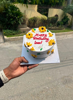 Load image into Gallery viewer, White cake decorated with yellow flowers and colorful details