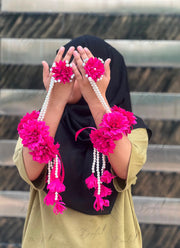 Pink and yellow flower accessory with pearl strands