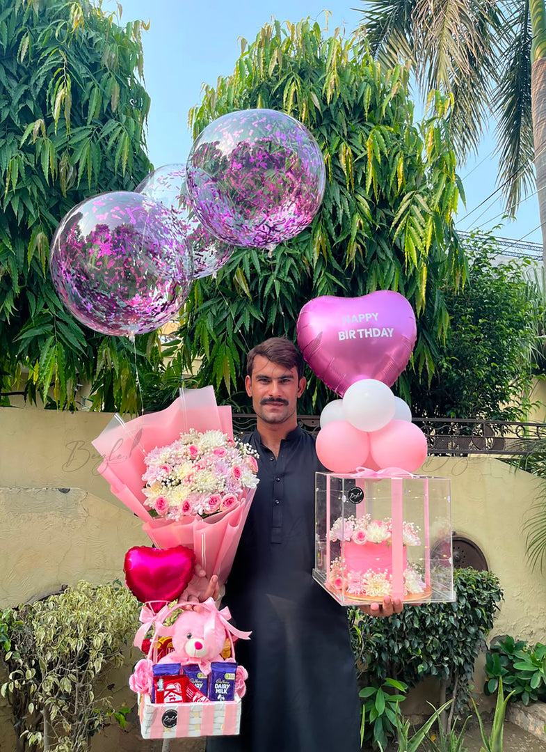 Luxury pink birthday hamper with flowers, chocolates and Happy Birthday balloons