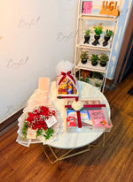 Load image into Gallery viewer, Red roses and snack gift boxes beautifully arranged for a special occasion