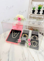 Blush jewelry gift box with gold jewelry and pink roses