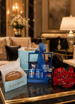 Load image into Gallery viewer, Chocolate cake with blue snack hamper and red rose bouquet