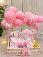 Load image into Gallery viewer, Pink Blossom Cradle luxury baby hamper with pink balloons, baby essentials, and decorative ribbon tray.