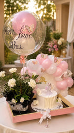 Load image into Gallery viewer, Elegant pink and white celebration arrangement featuring butterfly balloons, floral bouquet, and personalized birthday cake.