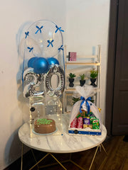 Cobalt Birthday Milestone cake and snack basket with blue balloon decoration