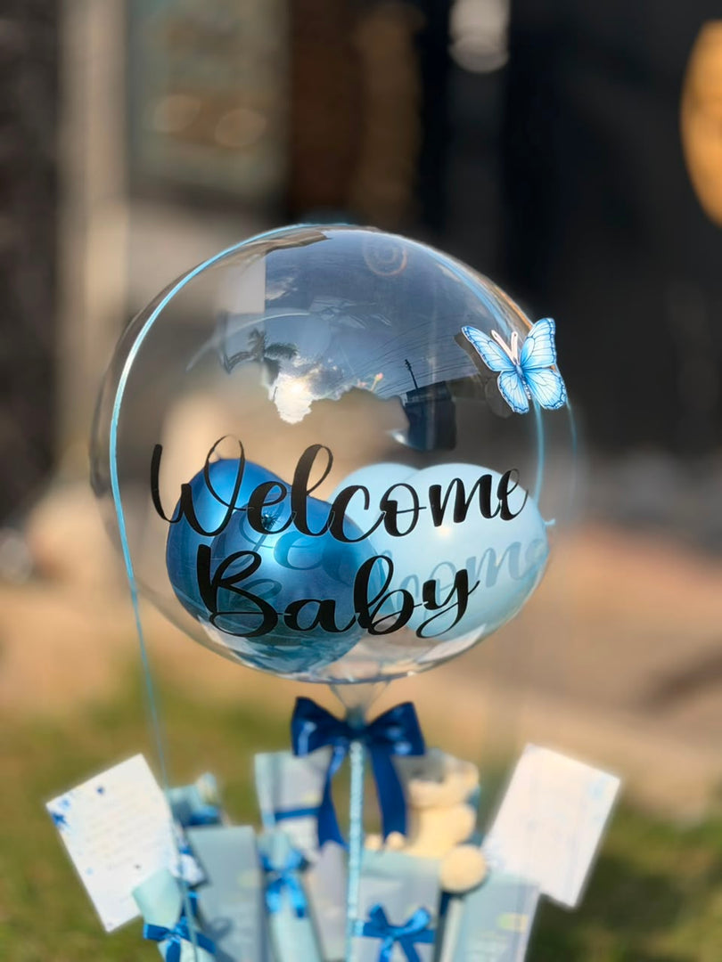Little Blue Joy newborn gift hamper with teddy bear and Welcome Baby balloon