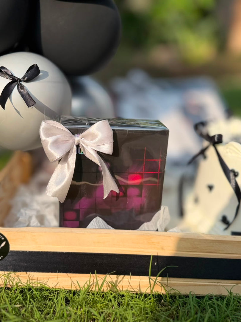 Close-up of curated black and white birthday gift box