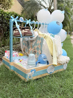 Load image into Gallery viewer, Blue baby welcome hamper decorated with butterfly balloons and baby clothing
