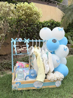 Load image into Gallery viewer, Bluebell Beginnings newborn gift hamper with baby clothes, tiny shoes, feeding bottle and blue white balloons