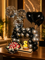 Load image into Gallery viewer, Luxury black and silver birthday setup with balloon arch, heart balloons, flowers, cake, and LED lights