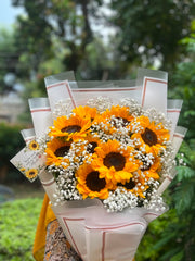 Sunflower and baby's breath bouquet in elegant wrapping