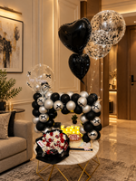 Load image into Gallery viewer, Make their birthday memorable with Midnight Elegance, featuring black and silver balloons, red flowers, birthday cake and glowing birthday details.