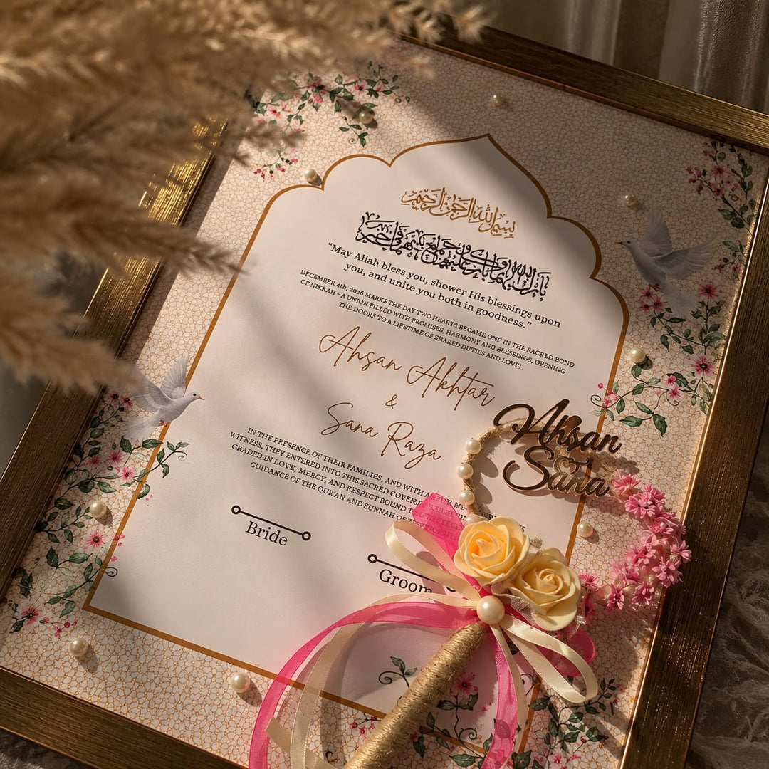 Personalised floral Nikah certificate with pink flowers, Arabic calligraphy, gold frame, pearl embellishments, and matching rose-decorated Nikah pen.