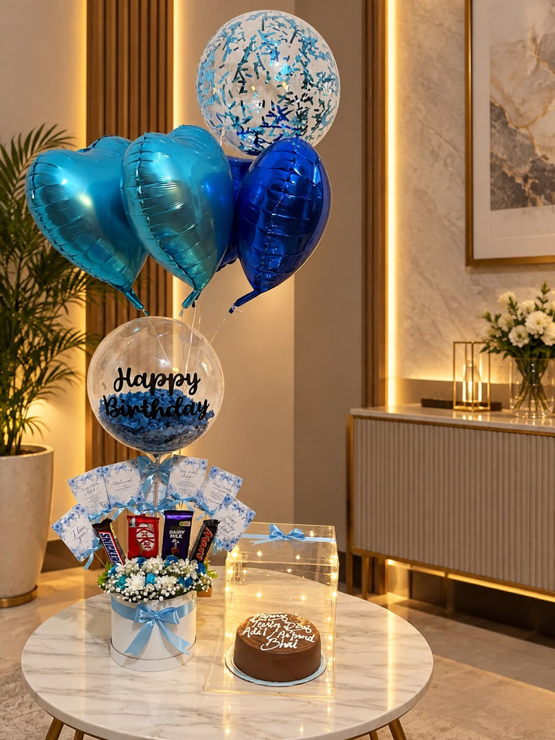 Azure Confetti Charm birthday gift set with blue balloons, chocolate floral arrangement, and cake display box