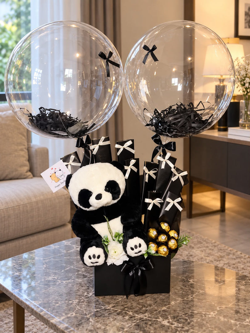 Midnight Panda Charm gift arrangement with panda plush, balloons, chocolates and black white decoration
